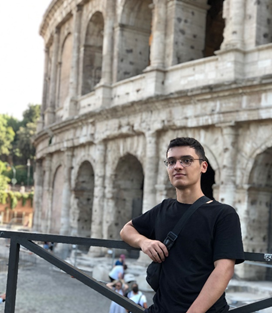 A picture containing building, outdoor, person, person Description automatically generated